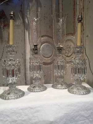 Deux paires de bougeoirs BACCARAT.