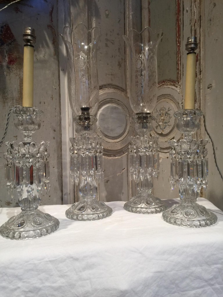 Deux paires de bougeoirs BACCARAT.