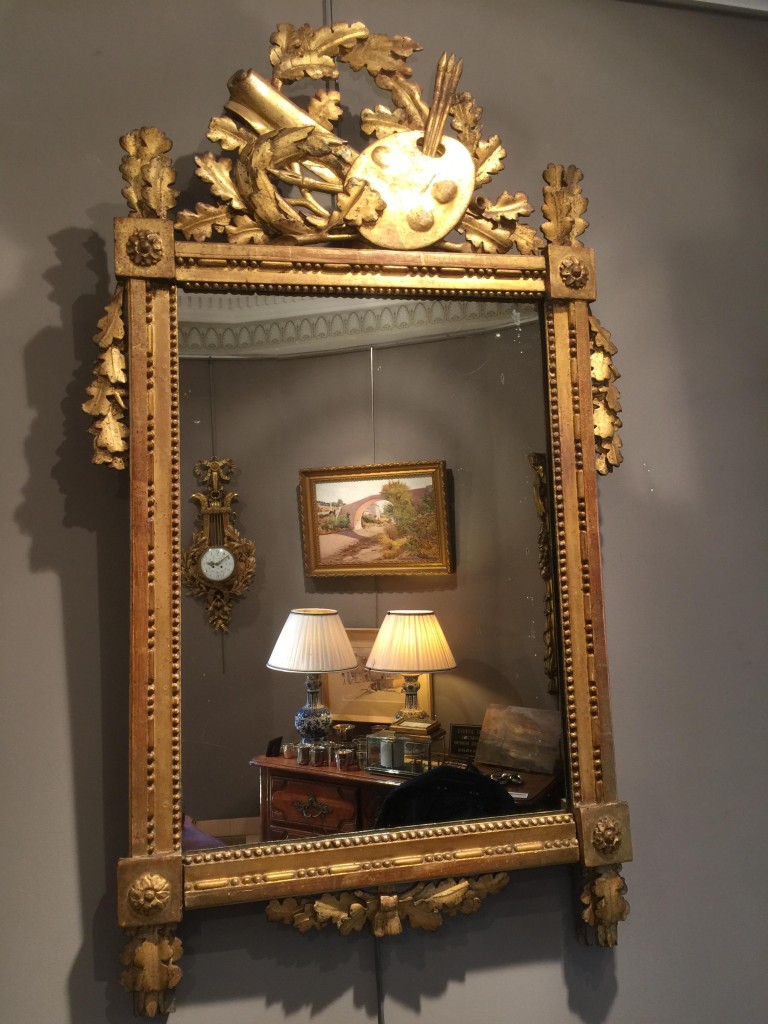 Miroir d’époque Louis XVI en bois doré.