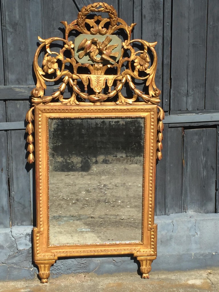 Miroir d’époque Louis XVI-Directoire en bois dorè.