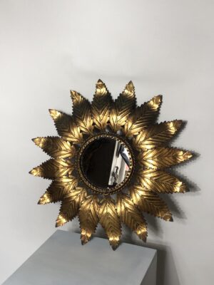 Miroir soleil en métal, XX ème siècle.